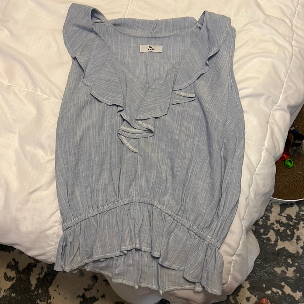 Cute light blue tank. Purchased in Italy. Size medium but fits like a small.